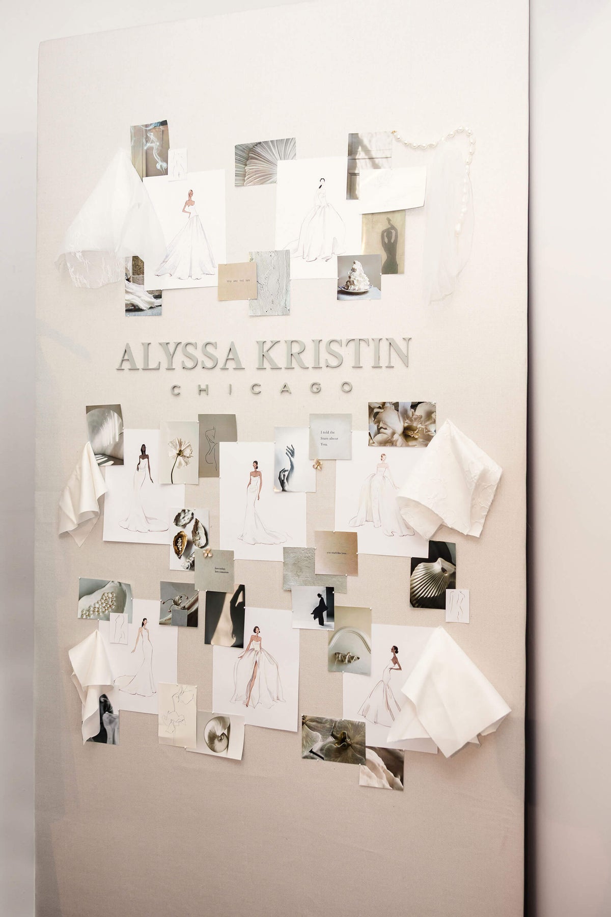 Collage of bridal dress photos and sketches on a wall by Alyssa Kristin Chicago