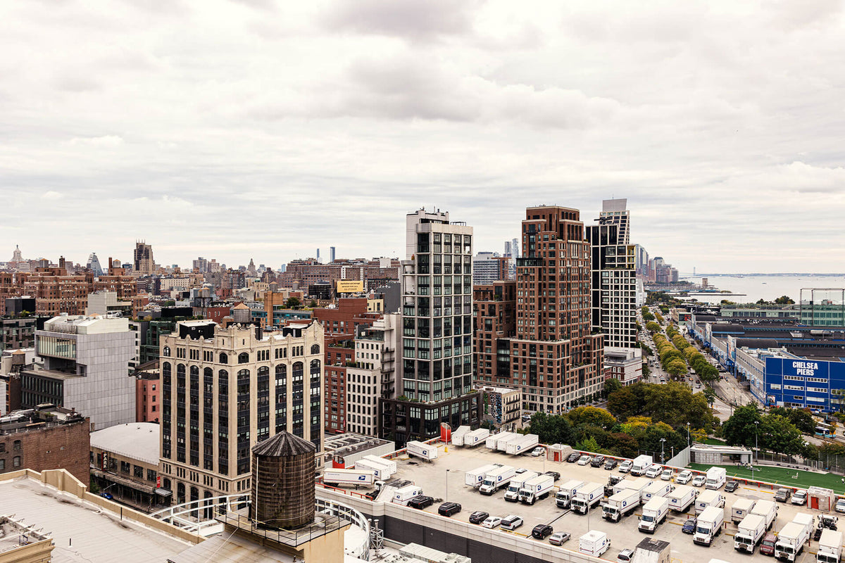 Cityscape with tall buildings and a cloudy sky
