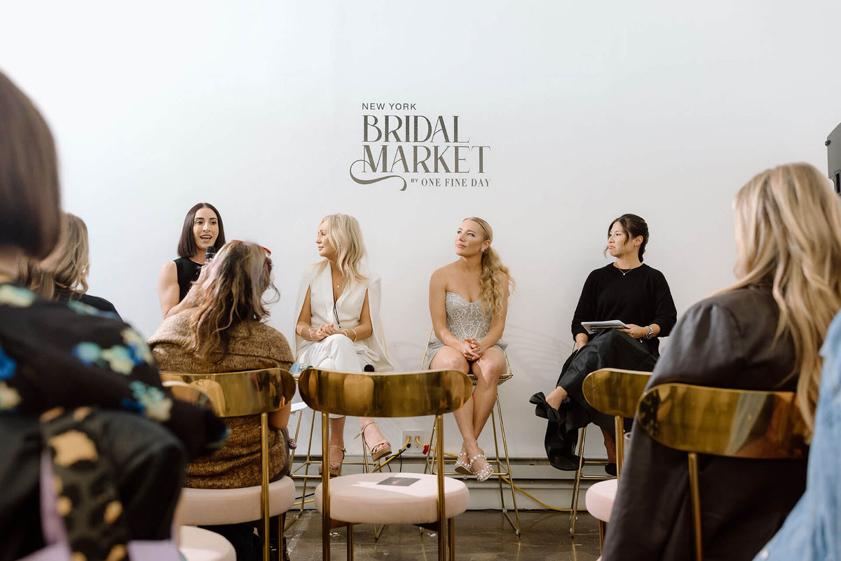 Panel discussion at the New York Bridal Market with speakers and audience.