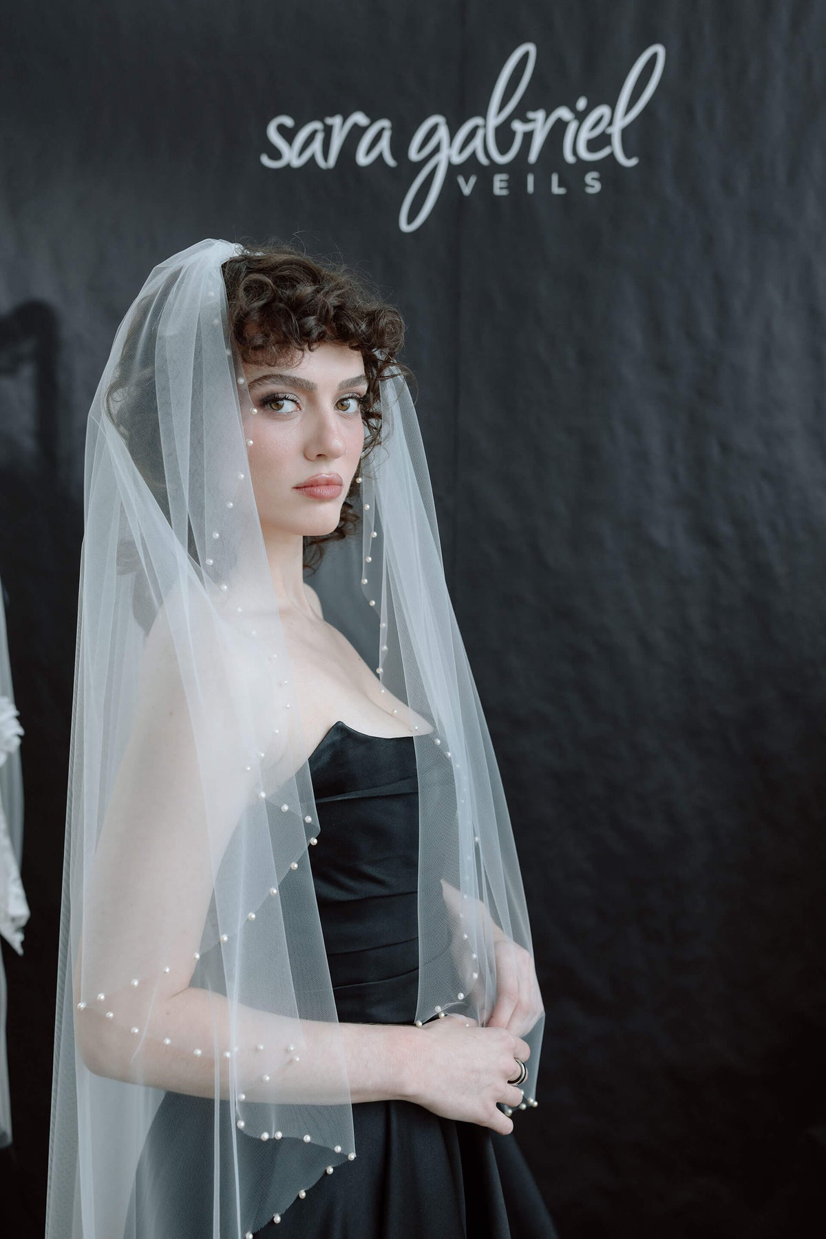 Woman wearing a veil by Sara Gabriel Veils - a bridal veils designer